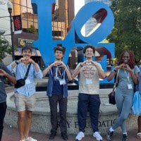 Students in front of Love sign